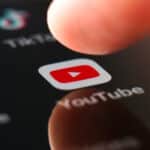 YouTube logo and finger